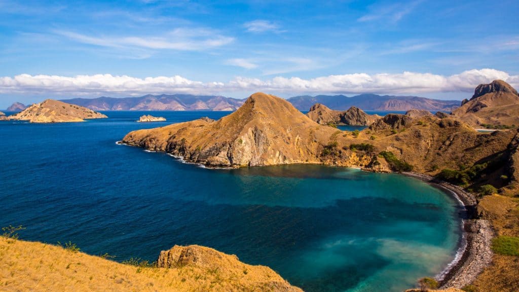 The coastline of Komodo National Park with beautiful blue waters and interesting landscape.